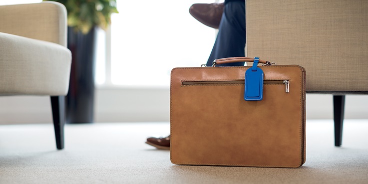 Suitcase with blue tag